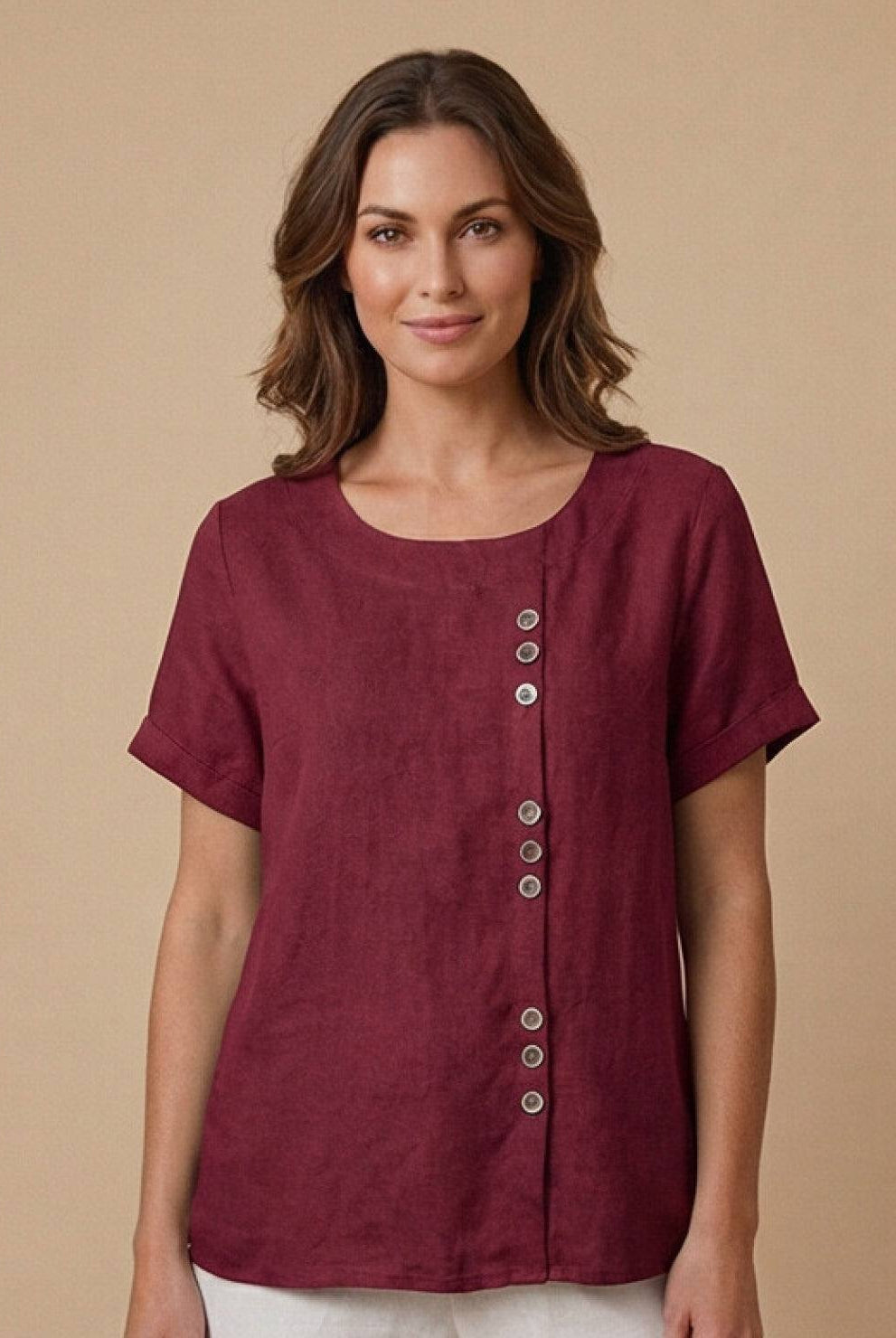 Light beige linen blouse with relaxed fit and button details from Lumina Wear's Grace collection.