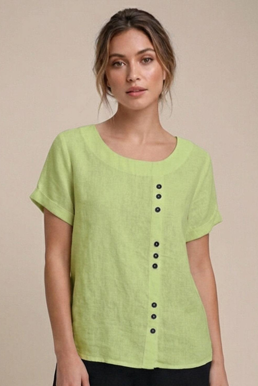 Lumina Wear Grace linen blouse with relaxed fit and button detail, showcased on a model in a casual setting.