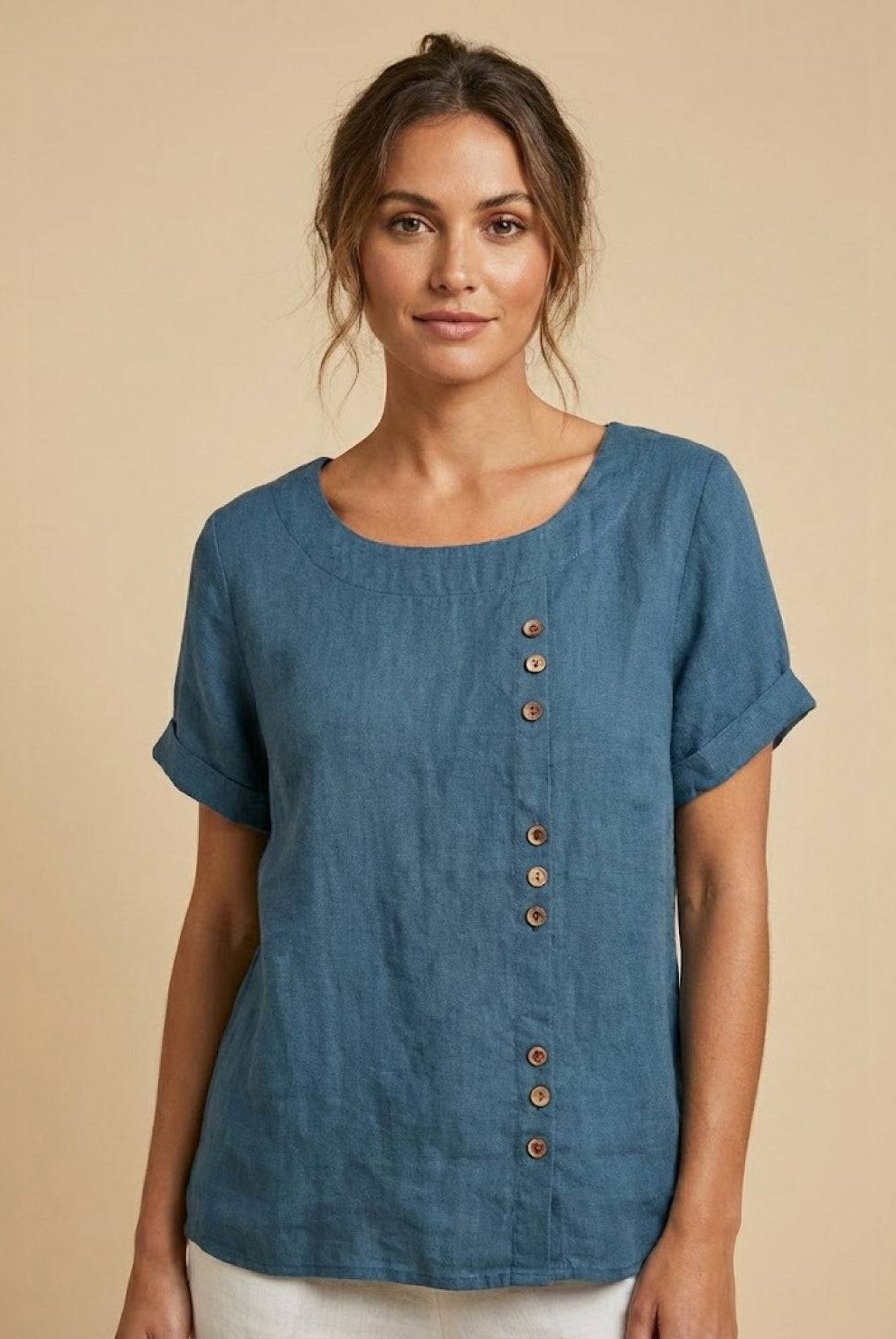 Light beige relaxed linen blouse with button details from Lumina Wear, featuring a comfortable, casual fit and stylish design.