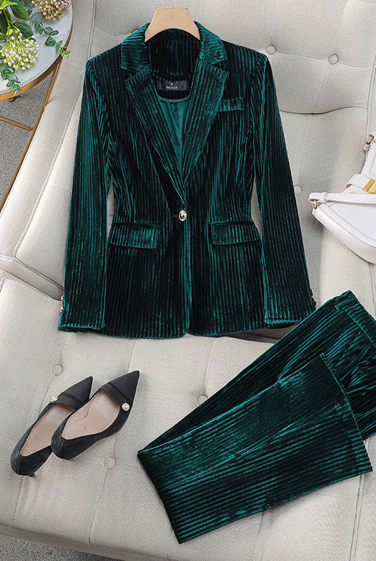 Women's tailored blazer and trousers set with polished silhouette from Lumina Wear, featuring a sleek, professional look.