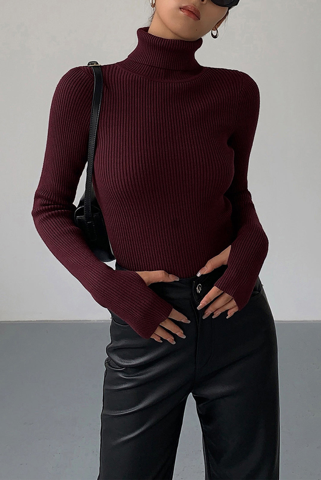 Lumina Wear Hailey sleek minimalist black turtleneck top for winter, featuring a fitted design and smooth fabric.
