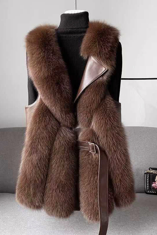 Lumina Wear Isabella belted faux fur vest with leather trim, showcasing a sleek silhouette and stylish design.