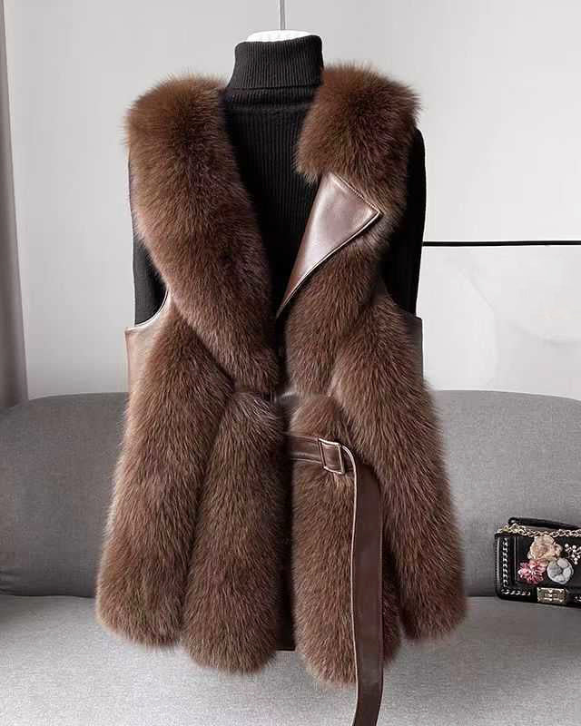 Lumina Wear Isabella belted faux fur vest with leather trim, showcasing a sleek silhouette and stylish design.