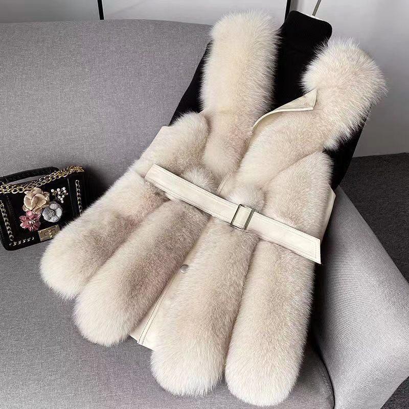 Isabella Lumina faux fur vest with leather trim, belted waist, and sleek silhouette, showcasing luxurious texture and stylish design.