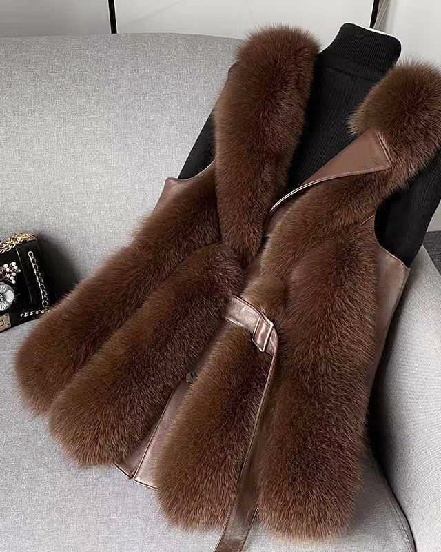 Isabella Lumina Wear belted faux fur vest with leather trim, showcasing a sleek silhouette and stylish details in a close-up photo.