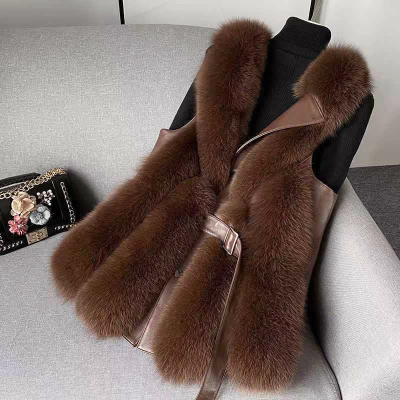 Luxurious Isabella faux fur vest with leather trim and sleek silhouette from Lumina Wear, featuring belt details and cozy texture.