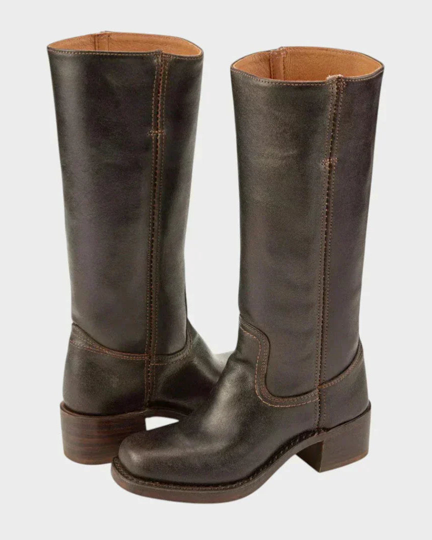 Black leather knee-high orthopedic boots with retro style from Lumina Wear, featuring a classic silhouette and sturdy sole.