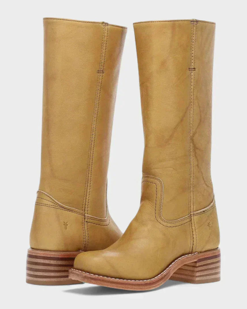 Black leather knee-high orthopedic boots with retro style by Lumina Wear, featuring a sleek design and sturdy heel.