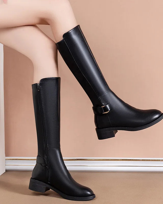Black knee-high boots for women with chic buckle accents from Lumina Wear's Isabella collection.