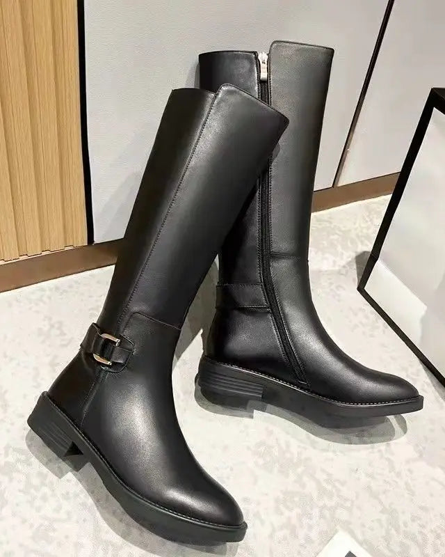 Black knee-high boots for women with chic buckle accents from Lumina Wear's Isabella collection.
