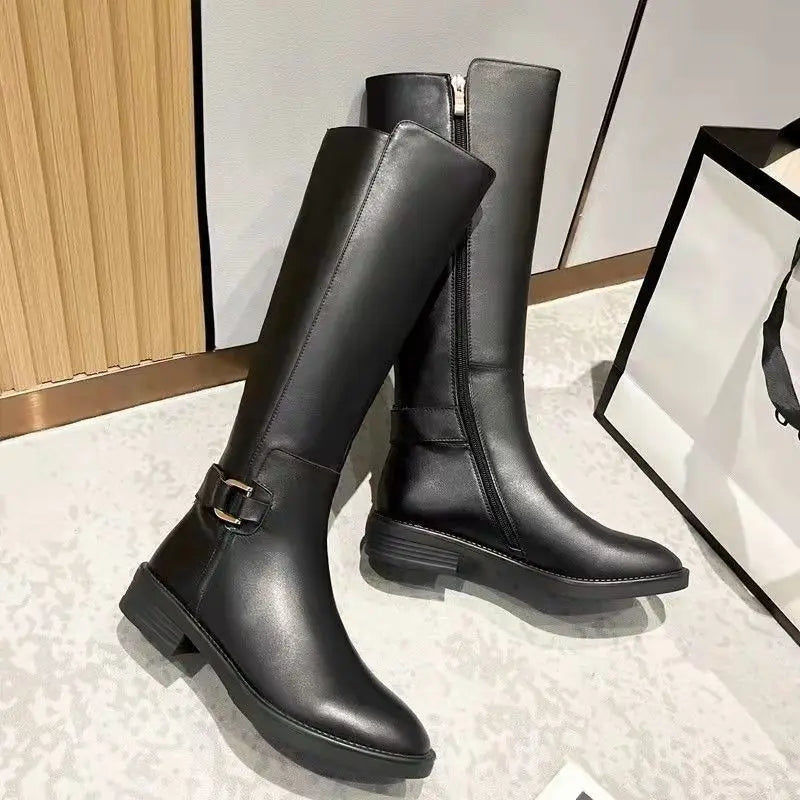 Black knee-high boots for women with chic buckle accents from Lumina Wear's Isabella collection.