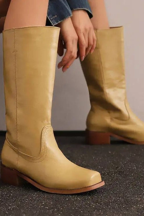 Black knee-high boots with stacked heel from Lumina Wear, featuring a sleek, elegant design perfect for women's fashion.