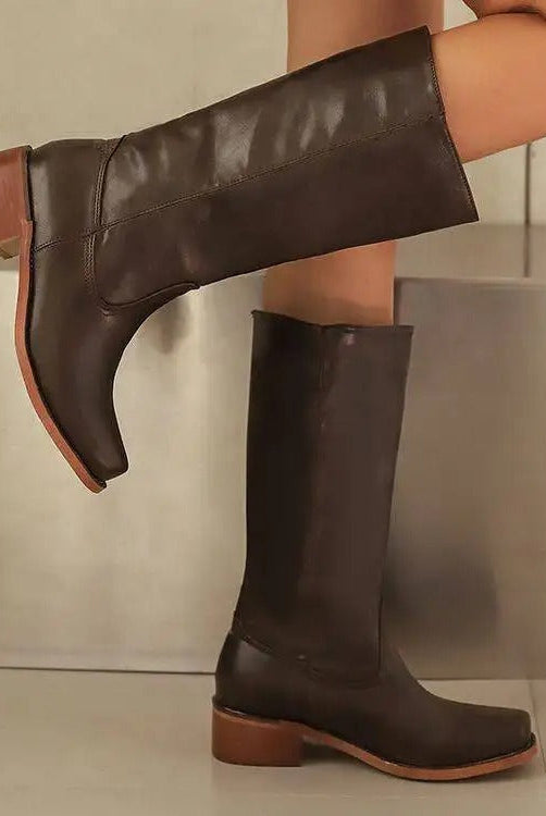 Elegant black knee-high boots with stacked heel from Lumina Wear, featuring sleek leather and stylish design.