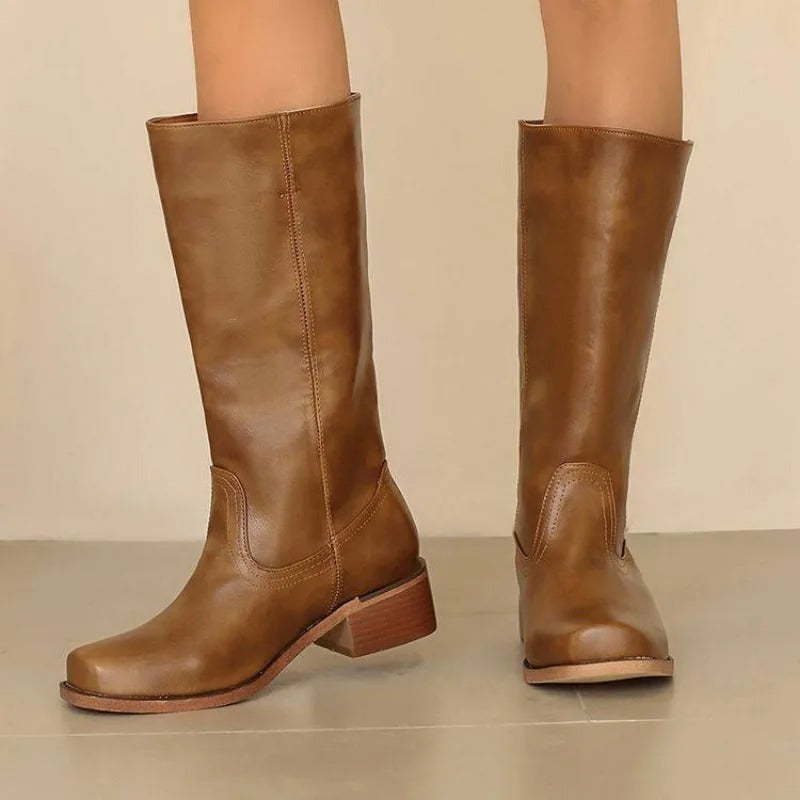 Black knee-high boots for women with stacked heels, stylish and elegant, by Lumina Wear, shown on a neutral background.