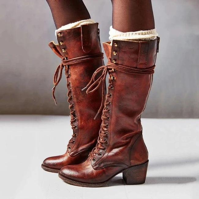Elegant black knee-high lace-up boots with side zipper for women by Lumina Wear, showcasing stylish details and sleek design.