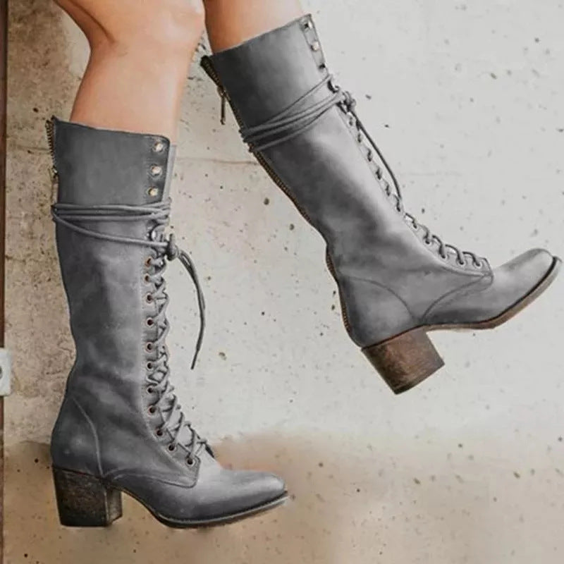 Black knee-high lace-up boots with side zipper for women by Lumina Wear, showcasing sleek design and stylish ankle-high fit.