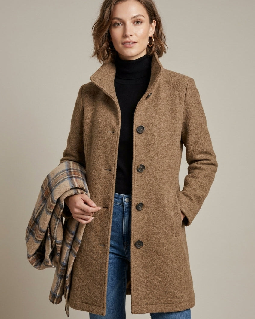 Elegant mid-length wool coat with notch collar and button front by Lumina Wear, displayed on a hanger.