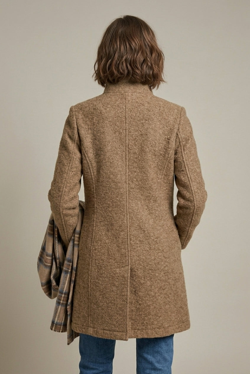 Elegant women's wool coat with notch collar and button front by Lumina Wear, mid-length style perfect for sophisticated winter looks.