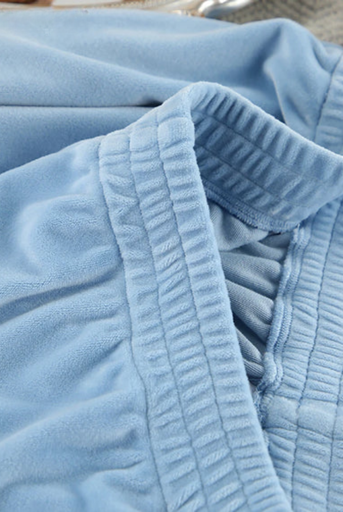 Light blue Solange pajama set with elegant notch collar and wide-leg pants from Lumina Wear, perfect for comfortable sleepwear.