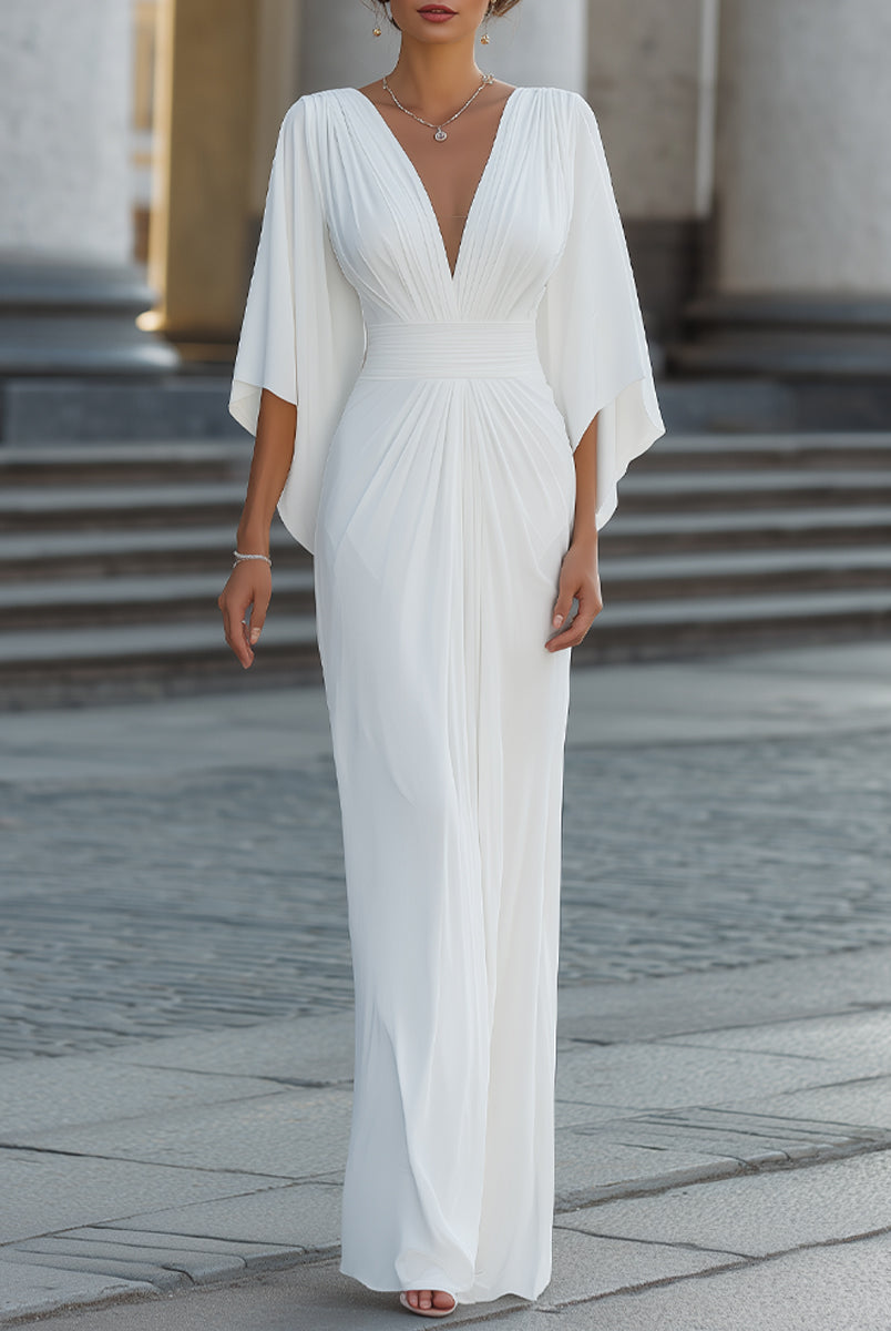 Elegant pleated maxi dress with cape sleeves by Lumina Wear, featuring flowing fabric and sophisticated design.