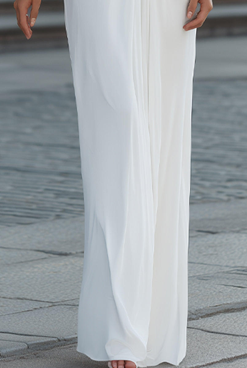 Elegant pleated maxi dress with cape sleeves from Lumina Wear, featuring flowing fabric and sophisticated design.