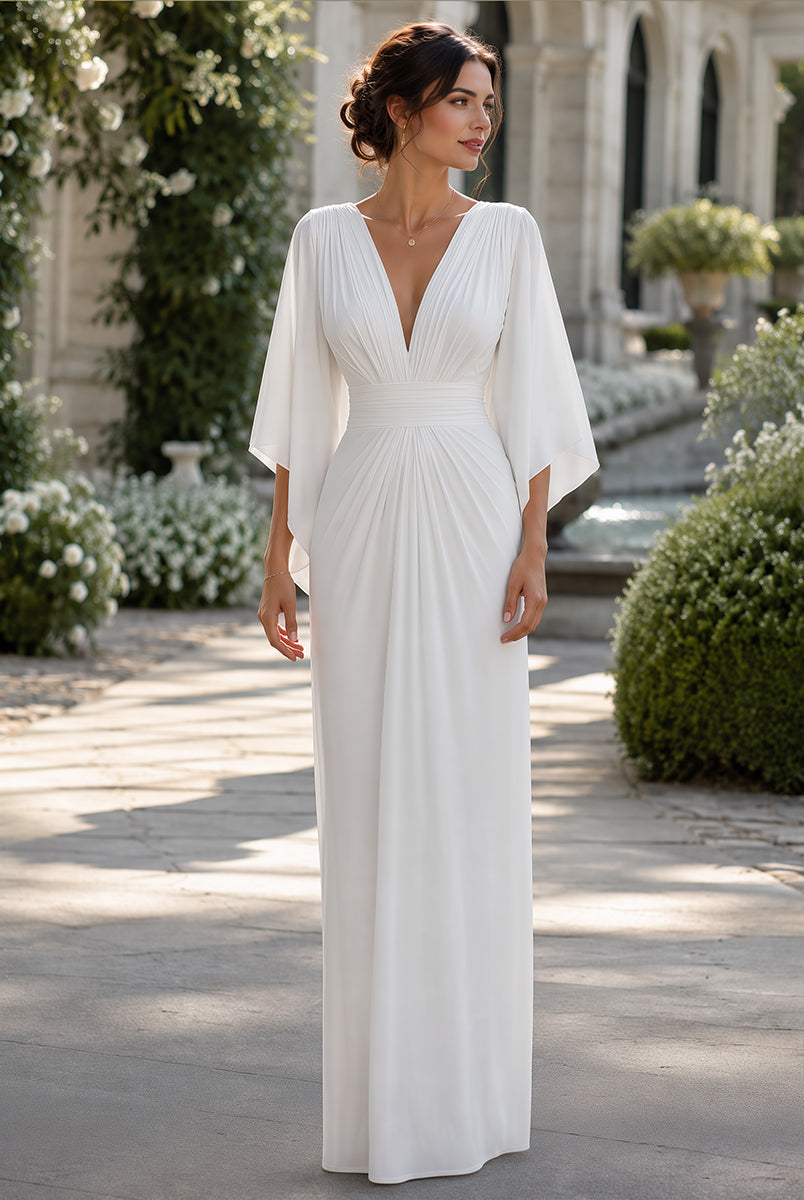 Isabella Lumina Wear elegant pleated maxi dress with cape sleeves, flowing fabric and sophisticated design for formal occasions.