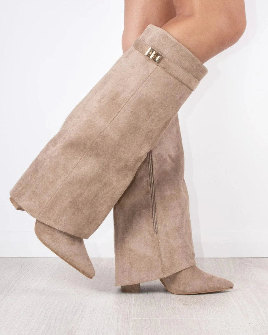 Black knee-high boots with pointed toes and side zippers from Lumina Wear's Isabella collection, styled with a sleek silhouette.