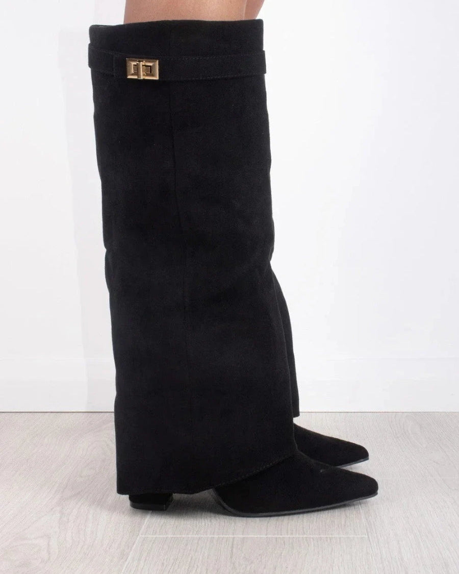Black knee-high boots with pointed toes and side zipper from Lumina Wear's Isabella collection, showcased on a model.