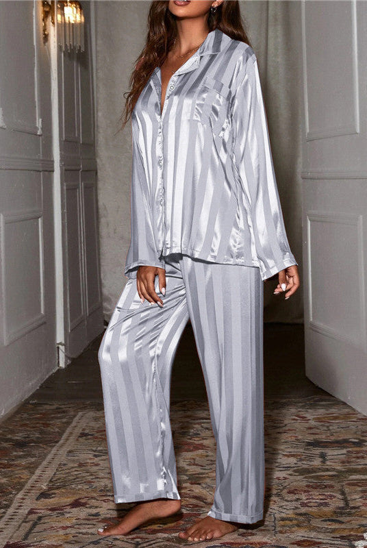 Elegant satin stripe pajama set by Lumina Wear featuring button front top and wide-leg pants, perfect for stylish sleepwear.
