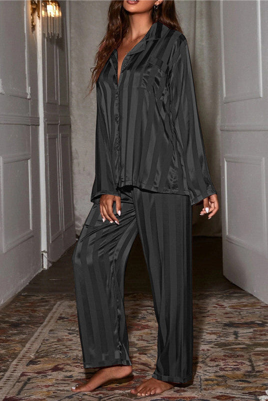 Elegant satin stripe pajama set by Lumina Wear featuring a button front top and wide-leg pants, displayed on a hanger.