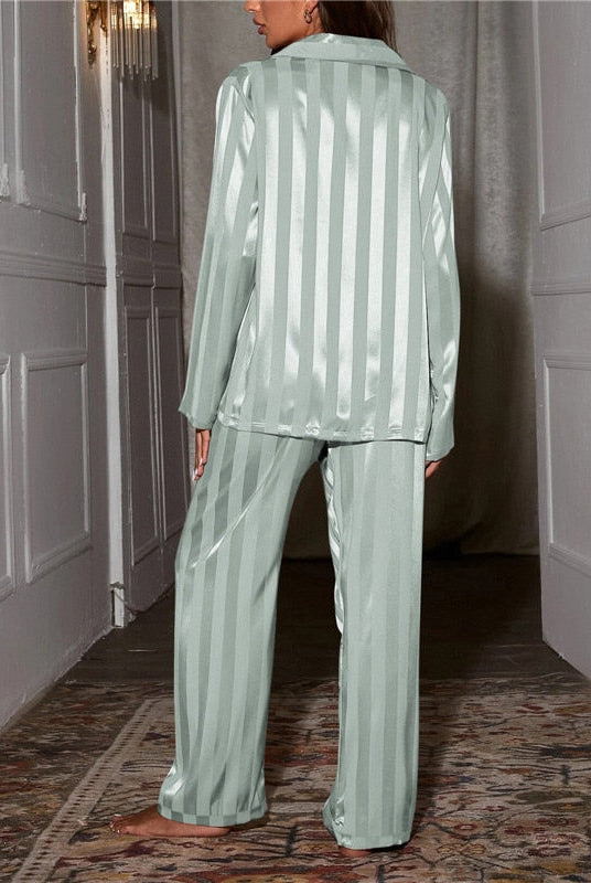 Elegant satin stripe pajama set by Lumina Wear featuring a button front top and wide-leg pants, perfect for comfortable sleepwear.