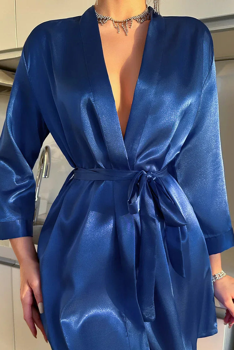 Elegant black silk kimono robe with V-neck and self-tie belt, featured in a luxurious sleepwear set by Lumina Wear.