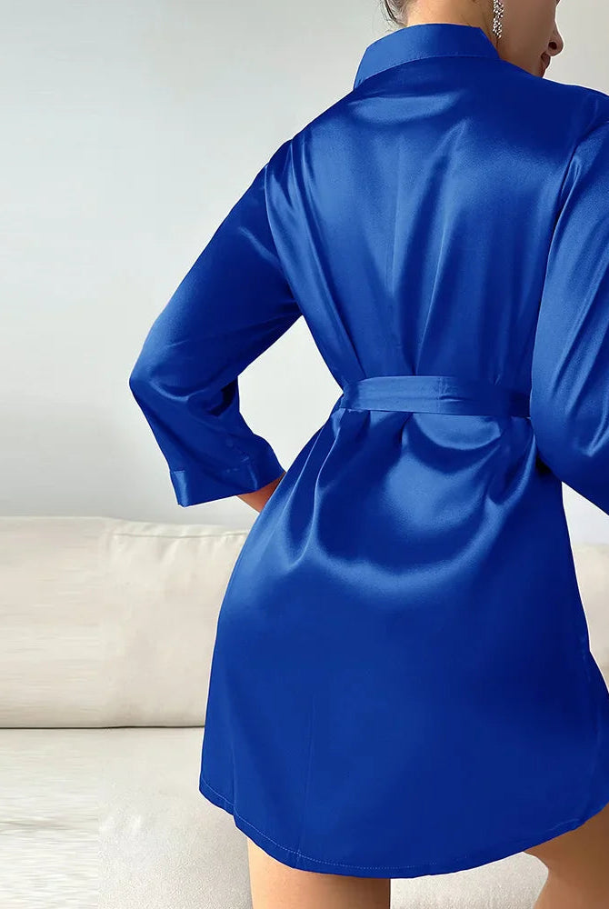 Elegant silk kimono robe with V-neck and self-tie belt from Lumina Wear, displayed hanging with intricate fabric details.