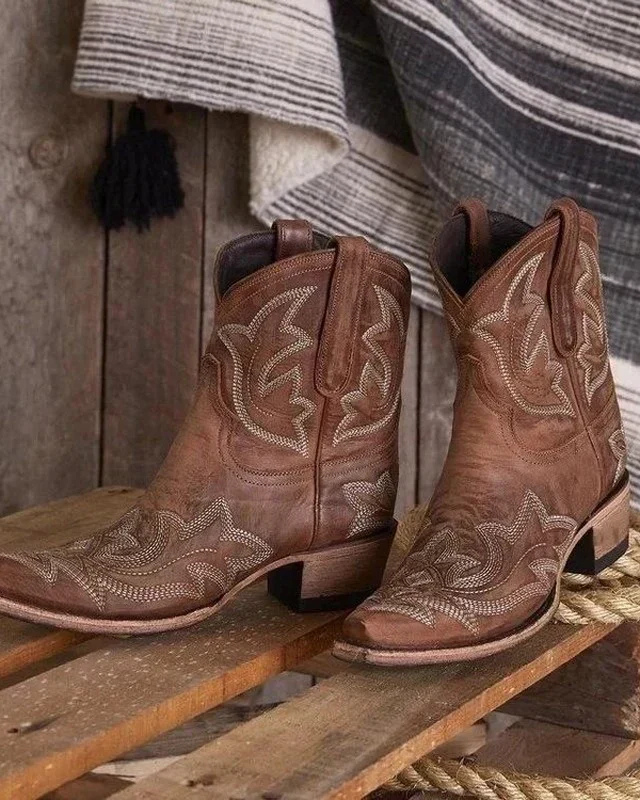 Isabella Lumina Wear embroidered mid-calf block heel boots with snip toe design and intricate embroidery.