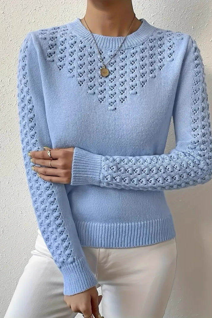 Lumina Wear Isabella fitted pointelle knit sweater with puff shoulders, showcasing a close-up of the stylish, textured knit fabric.