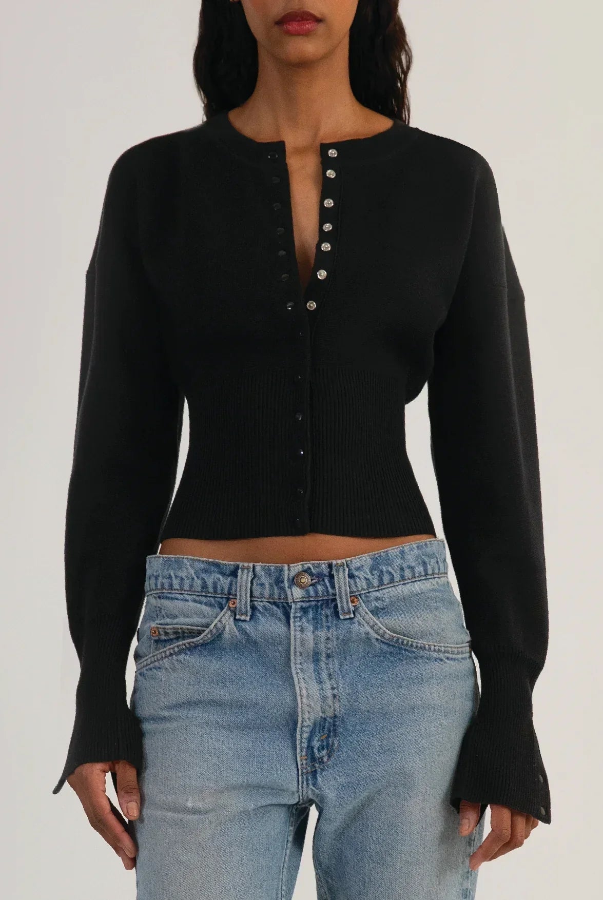 Fitted ribbed cropped cardigan with button closure from Lumina Wear's Isabella collection, featuring a stylish and snug fit.
