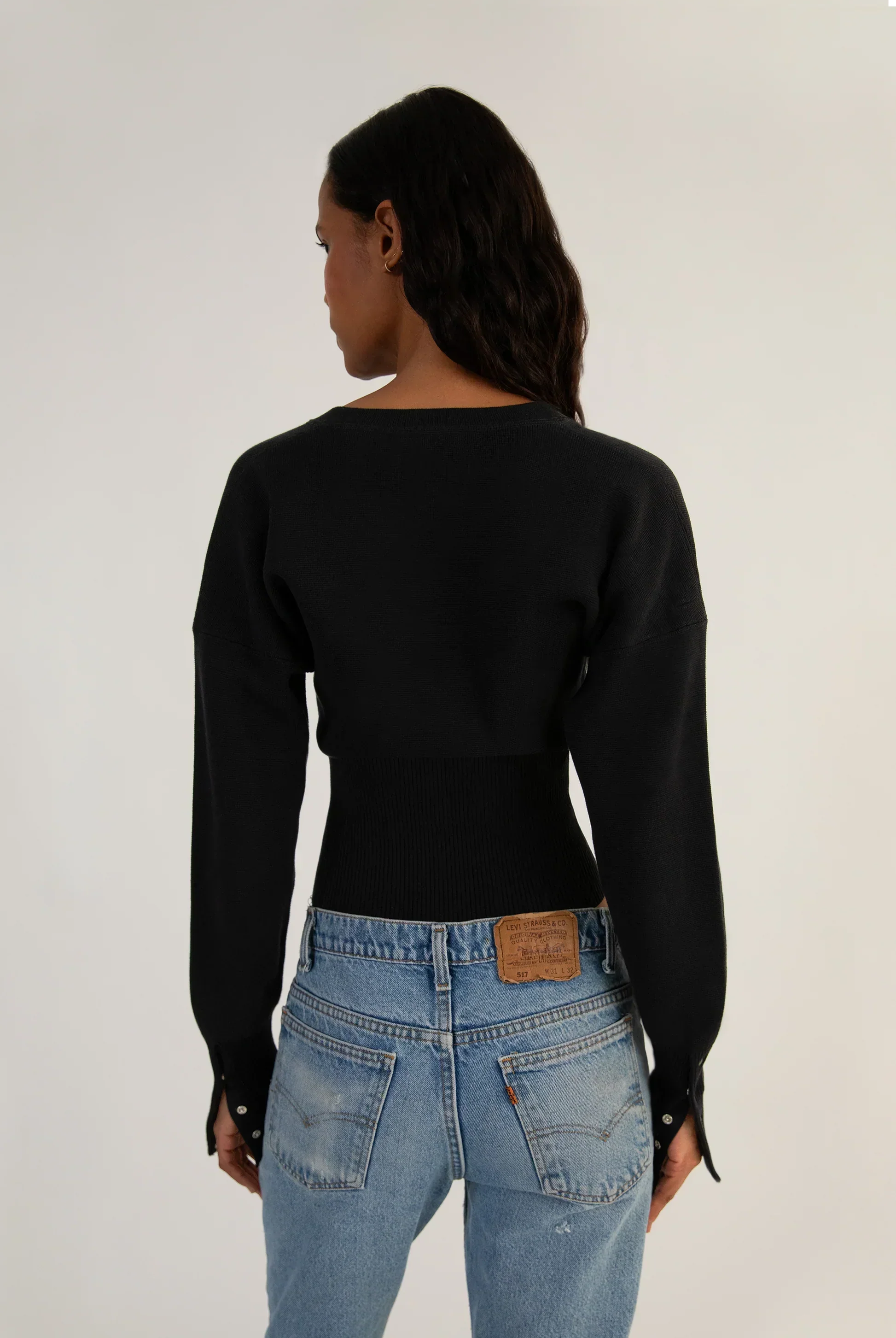 Fitted ribbed cropped cardigan with button closure by Lumina Wear, featuring a stylish, snug fit and textured knit fabric.