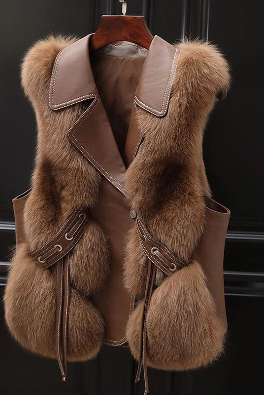 Lumina Wear Isabella fluffy vest with lapel collar, waist tie, and faux fur trim, shown on a model.