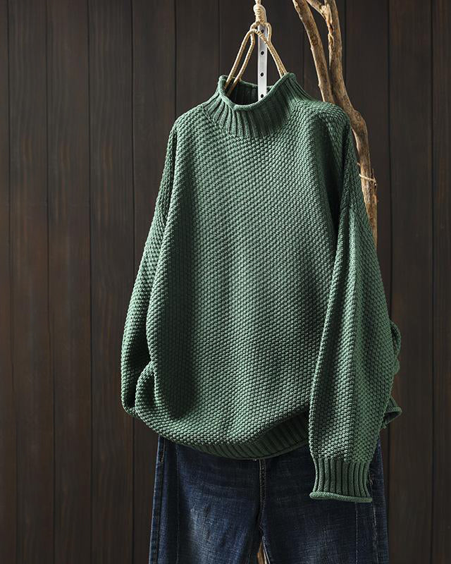 Light gray Isabella Lumina Wear high-neck textured knit sweater with a relaxed fit, shown on a model.