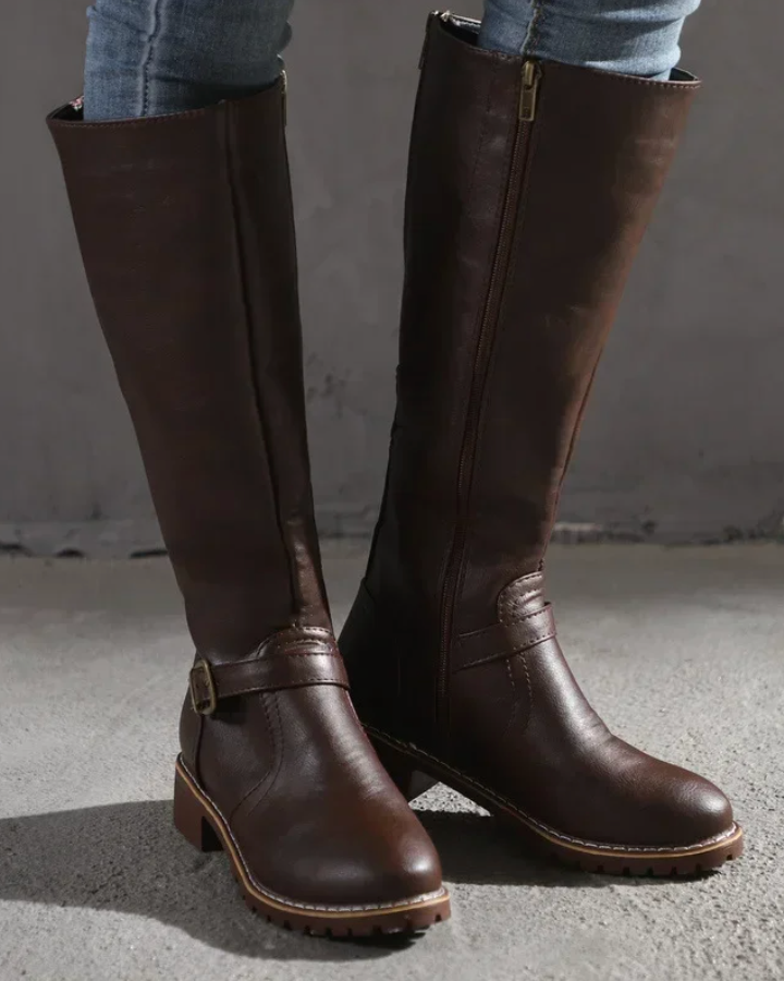 Isabella Lumina knee-high buckle strap boots with side zipper, black leather, stylish footwear for women.