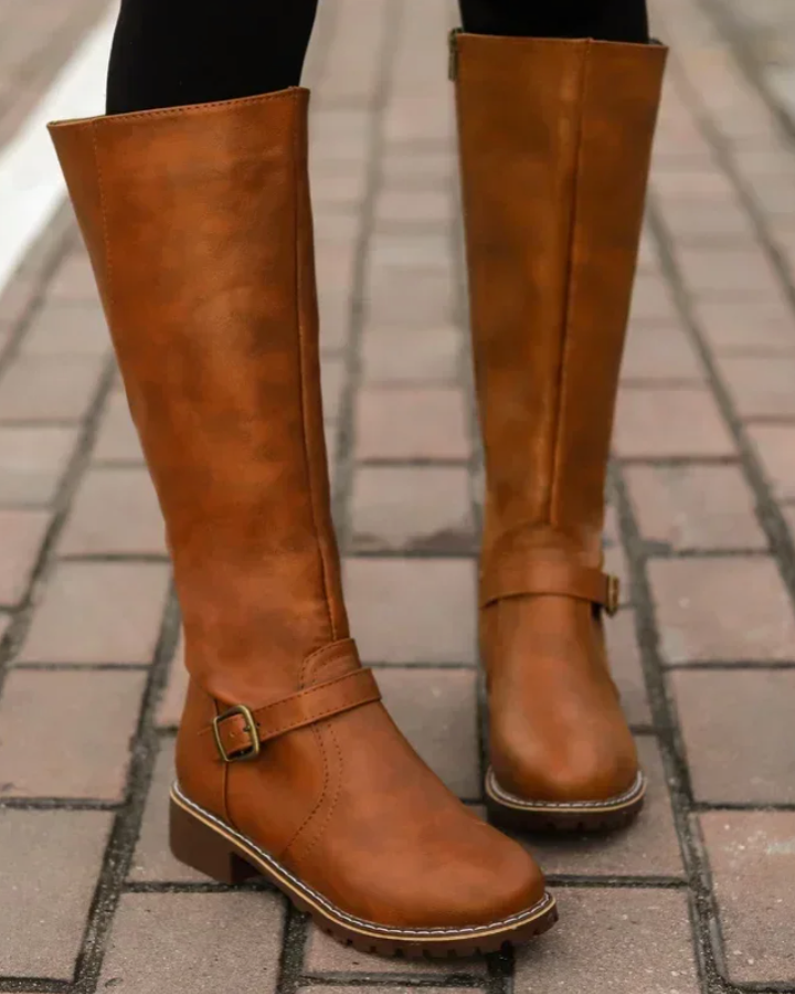 Isabella Lumina knee-high black leather boots with buckle straps and side zipper, stylish footwear for women.