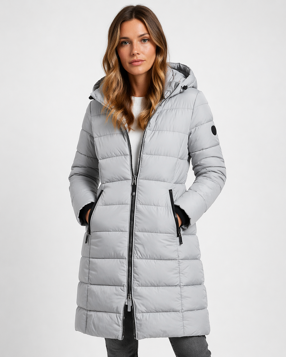 Lightweight quilted hooded puffer jacket with fitted silhouette from Lumina Wear, featuring a sleek design and cozy insulation.