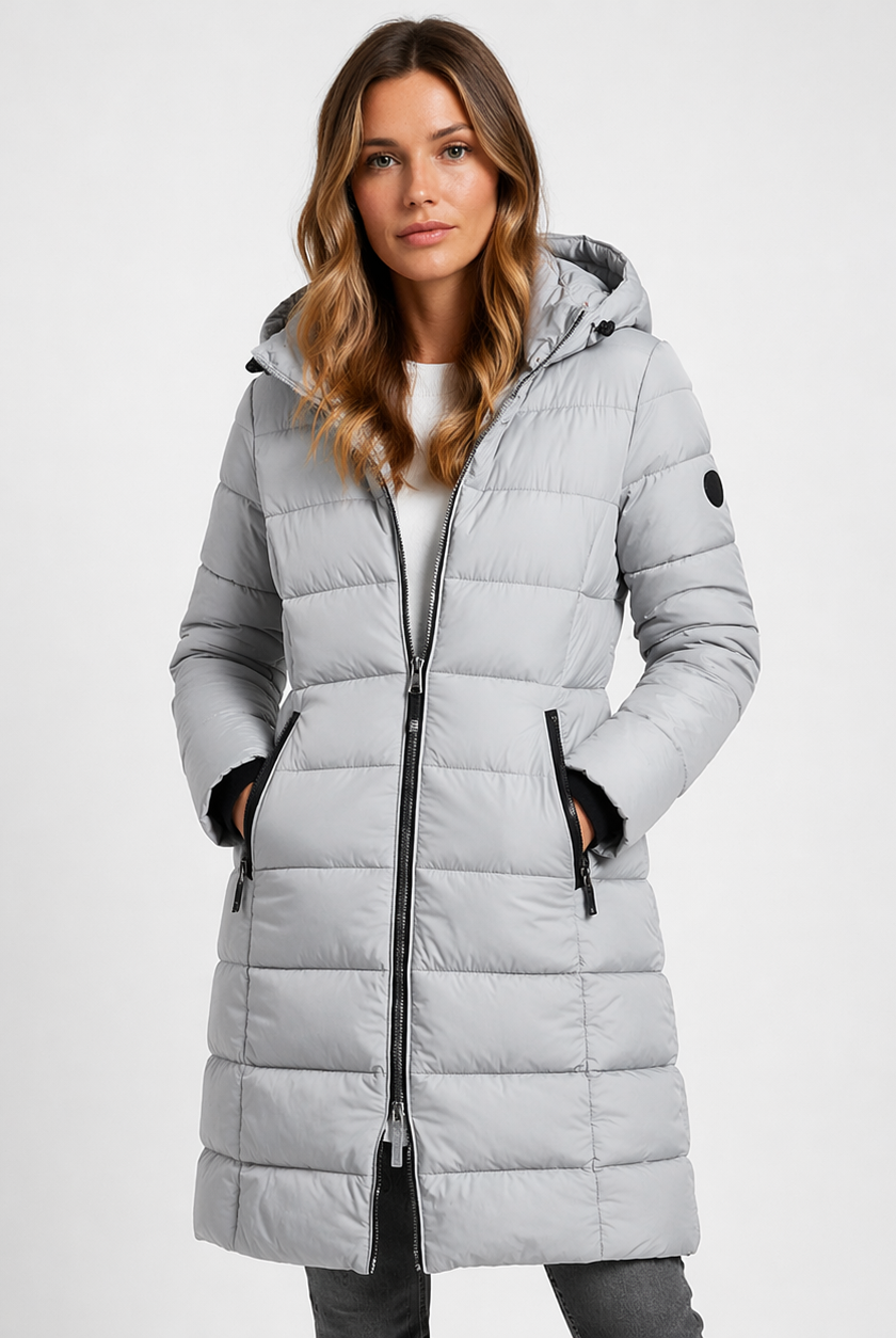 Lumina Wear Isabella lightweight quilted hooded puffer jacket with fitted silhouette, shown on a model.