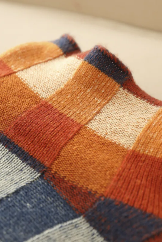 Multi-color checked Lumina Wear Isabella relaxed fit sweater with mock neck, featuring a cozy, stylish design and vibrant pattern.