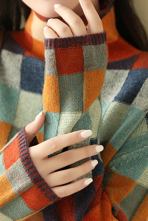 Multi-color checked relaxed fit sweater with mock neck by Lumina Wear, featuring cozy knit fabric and vibrant pattern.
