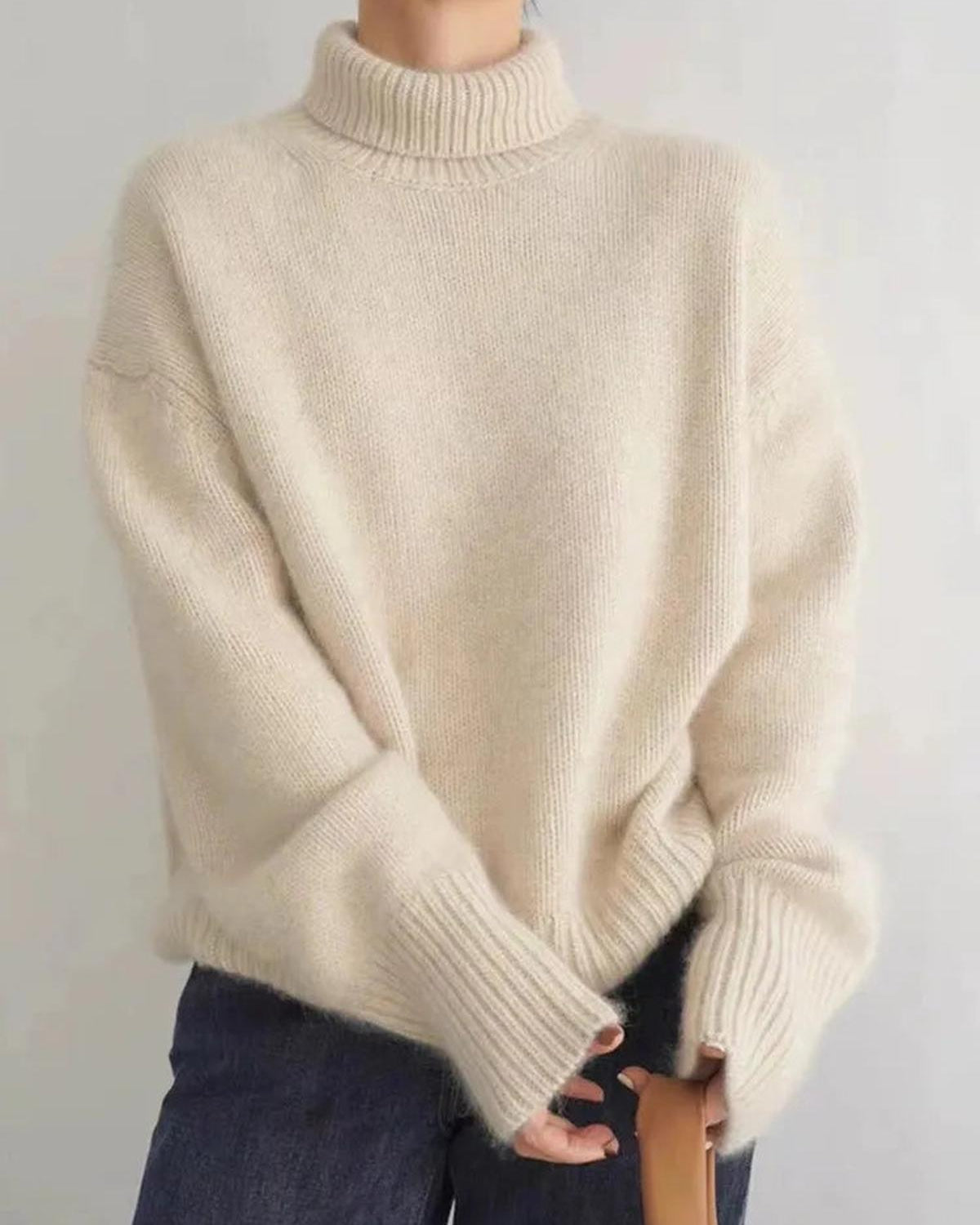 Black oversized turtleneck sweater by Lumina Wear featuring a relaxed fit and cozy, stylish design.