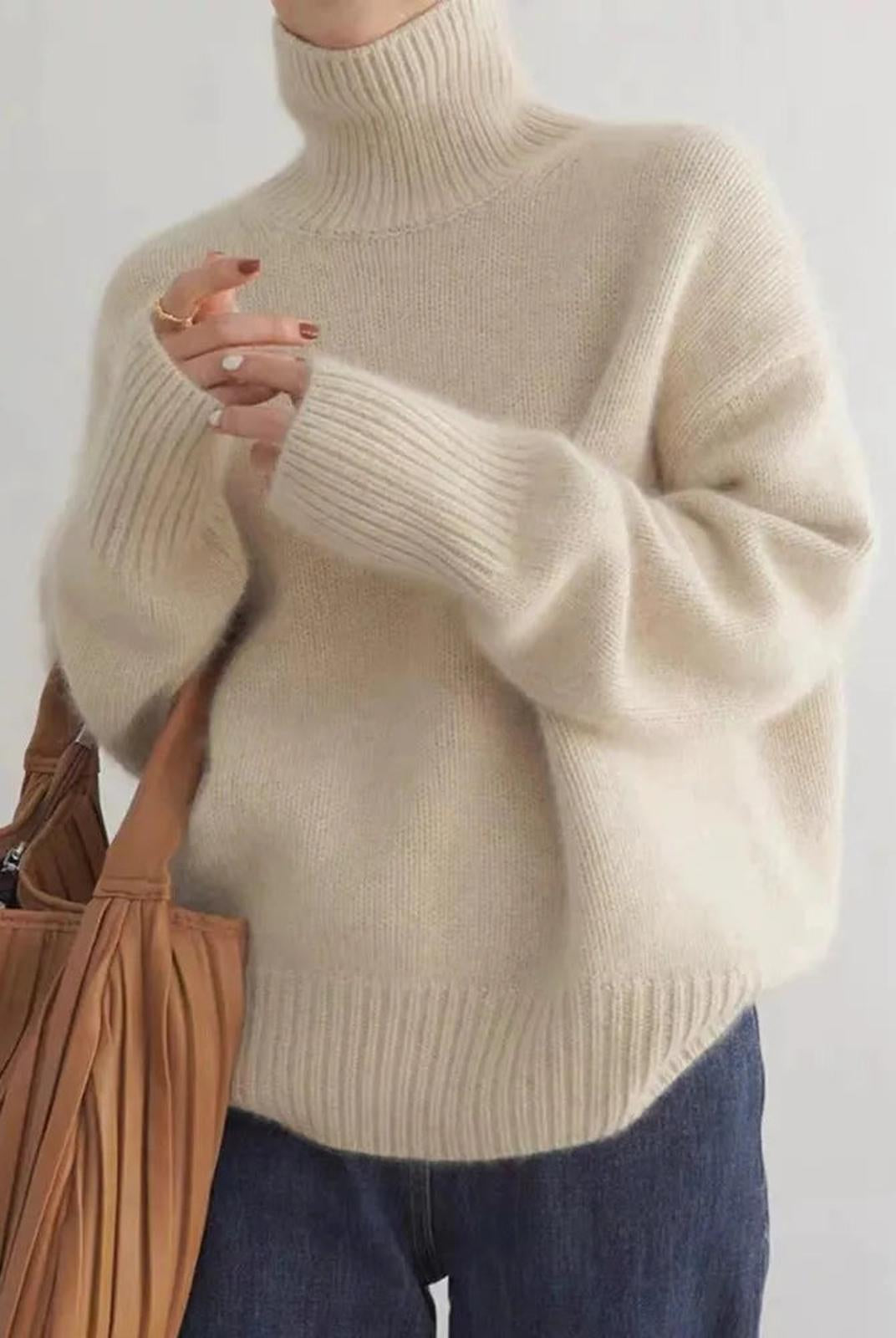 Black oversized turtleneck sweater by Lumina Wear featuring a relaxed fit and cozy design, displayed on a model.