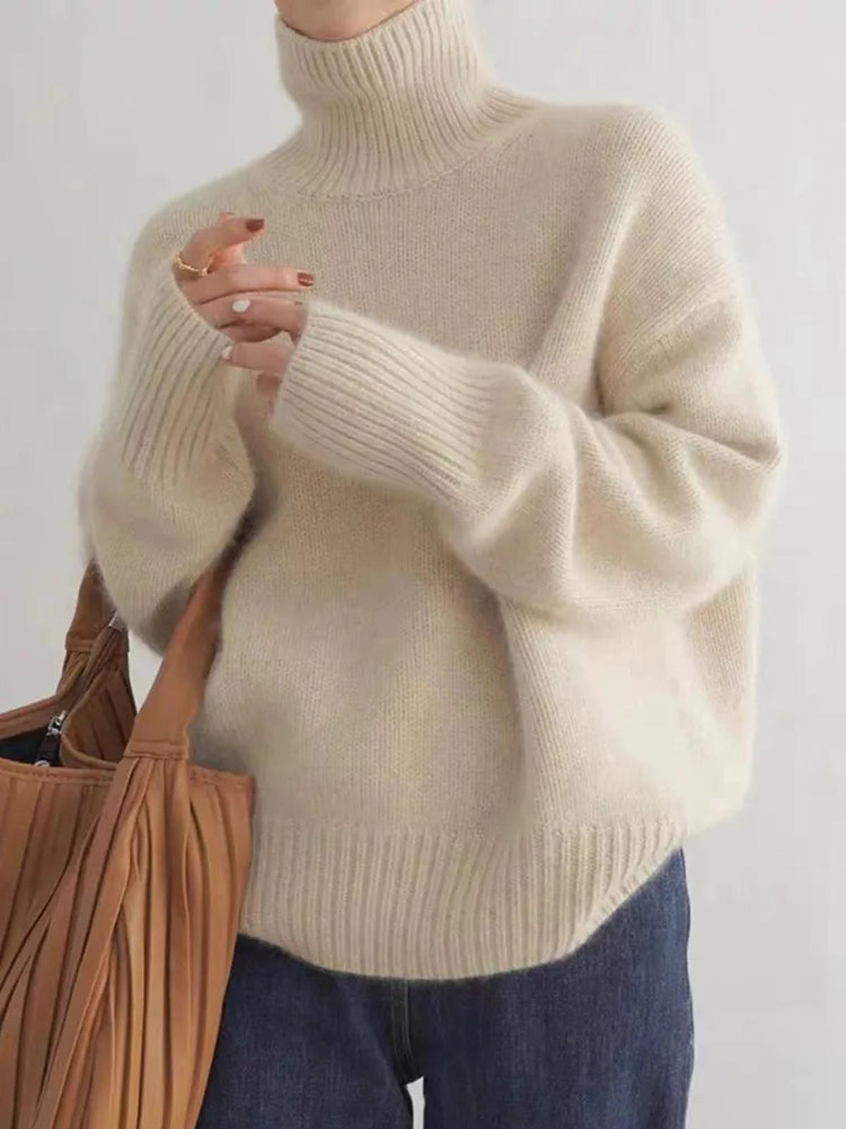 Isabella Lumina black oversized turtleneck sweater with relaxed fit, featuring soft knit fabric and cozy design.