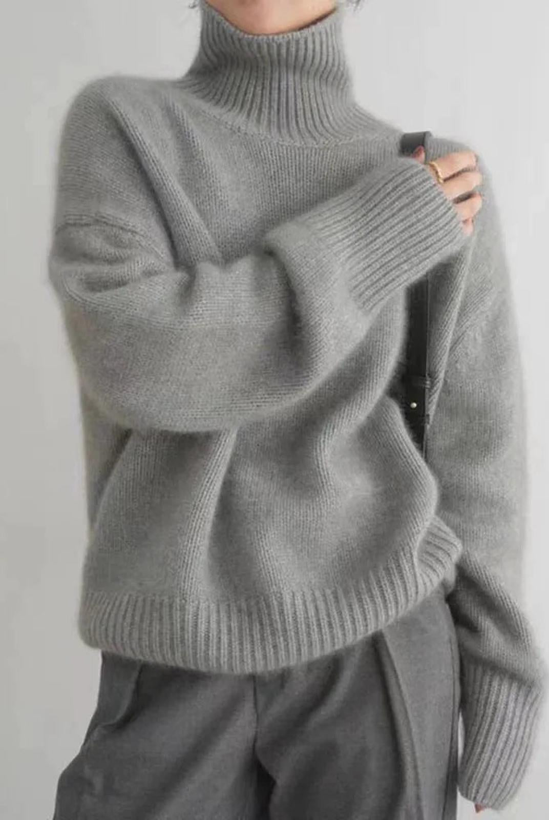 Black oversized turtleneck sweater by Lumina Wear featuring a relaxed fit and cozy style.