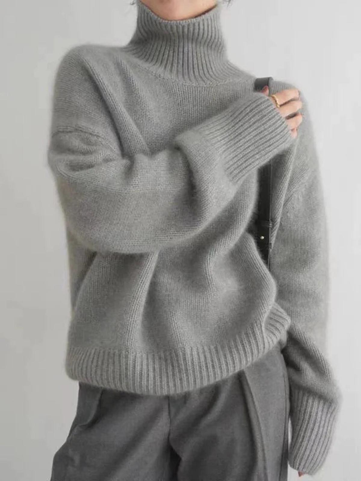Lumina Wear Isabella oversized black turtleneck sweater with relaxed fit, featuring soft knit fabric and cozy style.